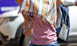A man is using a cloth to protect himself from the scorching heat on a hot summer day in J...