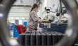 A worker is producing precision parts at a machinery company workshop in Nantong, Jiangsu...
