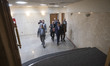 Former chairman of Iran's Central Bank, Abdolnasser Hemmati (C), is walking to a media cen...
