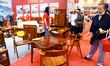 People are shopping for wooden furniture at HOME EXPO in Qingdao, Shandong province, China...