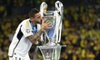 Joselu Mato of Real Madrid is celebrating with the trophy after the UEFA Champions League...