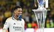 Jude Bellingham of Real Madrid is celebrating with the trophy after the UEFA Champions Lea...