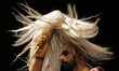 A Hindu priest is worshipping during Ganga aarti on the ghats of the river Ganga after the...