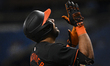 Anthony Santander #25 of the Baltimore Orioles is reacting after hitting a solo home run d...