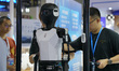 Visitors are visiting artificial intelligence robot products displayed at the robot exhibi...