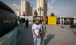 Iranian youths are walking along a recreation area in western Tehran, Iran, on June 14, 20...