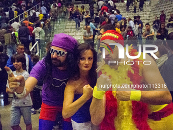 Wrestling fans dressed as  famous wrestler Hulk Hogan and Demolition Man during the WWE Live in Turin. (