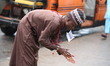 A Muslim faithful is washing his hands as Muslim faithful are praying to mark the Eid-El-K...