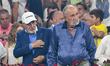 Ion Tiriac and Ilie Nastase are attending a tennis demo event during a sports festival in...