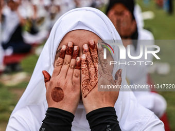 A girl is taking part in the 10th International Yoga Day Celebrations in Baramulla, Jammu and Kashmir, India, on June 21, 2024. Indian Prime... by Nasir Kachroo/NurPhoto