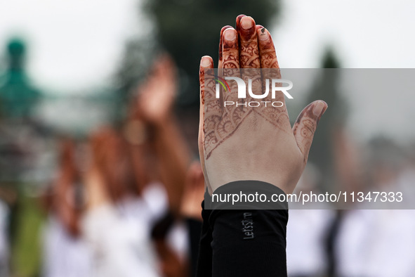 People are taking part in the 10th International Yoga Day Celebrations in Baramulla, Jammu and Kashmir, India, on June 21, 2024. Indian Prim... by Nasir Kachroo/NurPhoto