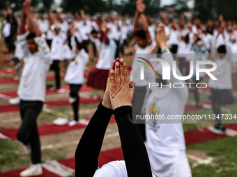 People are taking part in the 10th International Yoga Day Celebrations in Baramulla, Jammu and Kashmir, India, on June 21, 2024. Indian Prim... by Nasir Kachroo/NurPhoto