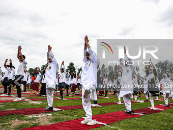 People are taking part in the 10th International Yoga Day Celebrations in Baramulla, Jammu and Kashmir, India, on June 21, 2024. Indian Prim... by Nasir Kachroo/NurPhoto