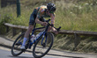 A male rider is participating in the British National Road Cycling Championships in Saltbu...