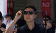 A man is testing smart glasses at the Xreal booth at SNIEC in Shanghai, China, on June 26,...