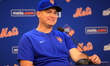 New York Mets manager Carlos Mendoza #64 is speaking to the media before the baseball game...