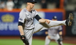 New York Yankees pitcher Tim Hill #54 is throwing during the eighth inning of the baseball...