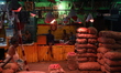 Labourers are resting after work in a wholesale vegetable market in Kolkata, India, on Jun...