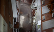 An apartment block is being pictured after it was hit by a Russian missile in Dnipro, Ukra...