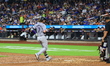 Colorado Rockies' Brendan Rogers #7 is homering during the seventh inning of a baseball ga...