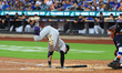 Colorado Rockies' Brenton Doyle #9 is skipping out of the way of an inside pitch during th...