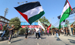 Kashmiri Shia Muslims are displaying Palestinian flags during a procession on the 8th of M...