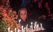 A young Iranian woman is lighting a candle during a candle-lighting ceremony to mark the a...