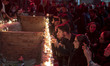 Iranian youths are lighting candles during a candle-lighting ceremony to mark the annivers...