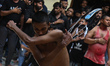 Shiite Muslims are flagellating themselves during a procession to mark Ashura, in the old...