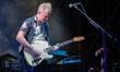 Gary Kemp is playing the guitar during the live performance with Nick Mason's Saucerful of...