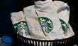 PARIS, FRANCE - JULY 16:   Starbucks T-shirt displayed inside a Starbucks cafe in Montmar...