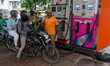 A crowd is gathering at a petrol filling station in Kolkata, India, on July 22, 2024. Peop...