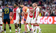 Ajax player Jorrel Hato and Ajax player Branco van den Boomen are playing during the match...