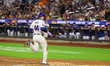 Harrison Bader #44 of the New York Mets is scoring during the fourth inning of the basebal...