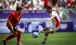 Mohamed Shehata of the Egypt team is battling for possession with Bernabe Adrian of the Sp...