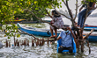 A security guard is sitting on a chair at Sambranikodi Island in Kerala, India, on April 0...
