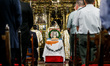 A photograph of Makarios is being seen on a table with the flag of Cyprus during the servi...