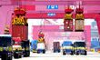 Cargo ships are loading and unloading foreign trade containers at the fully automated term...