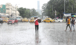 A man is crossing a busy road during heavy monsoon rain in Kolkata, India, on July 07, 202...
