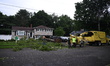 A large tree is uprooting and causing major damage to a home on Wynetta Place during sever...