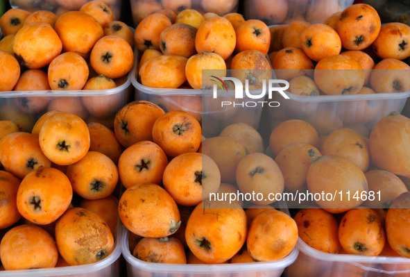 A The loquat (Eriobotrya japonica) displays in the shop in Rafah in the southern Gaza Strip on May 17, 2014. 