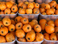 A The loquat (Eriobotrya japonica) displays in the shop in Rafah in the southern Gaza Strip on May 17, 2014. (