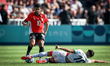 Ibrahim Adel of the Egypt team is battling for possession with Ilias Akhomach of the Moroc...