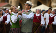 KRAKOW, POLAND - AUGUST 10:Participants dance and watch other performances as they wait f...