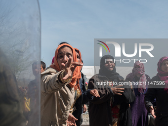 Womens crying after crossing the police line in the rail tracks in Idomeni on April 7, 2016. (
