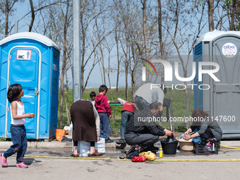 Refugees cleaning their clothes in Eko Station, Polykastro on April 4, 2016 (