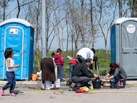 Refugees cleaning their clothes in Eko Station, Polykastro on April 4, 2016 (
