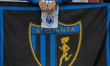 An Atalanta BC supporter is standing on the tribune before the Supercup final between Real...