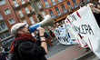A member of the "Nuit Debout" movement shouts slogans during a protest against the El-Khom...