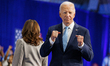 U.S. President Joe Biden greets people as he exits the stage at an event about lowering co...